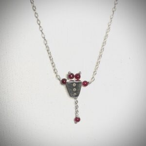 Silver necklace with ruby beads
